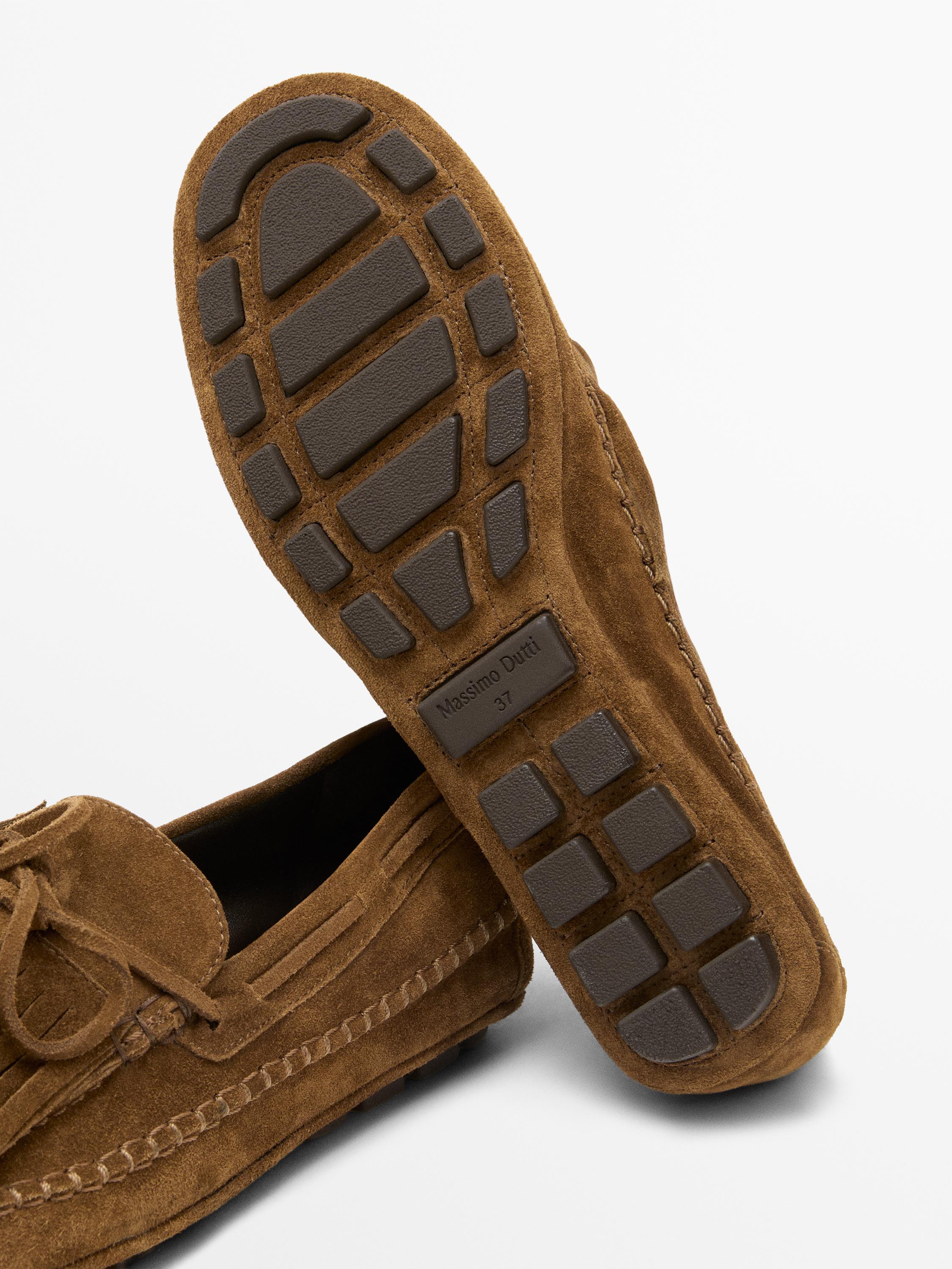 Mocassin à franges et pompons en croûte de cuir